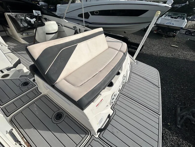 Slide: The Image of 2016 Sea Ray SPX 210 boat interior with seating and deck view. - 9