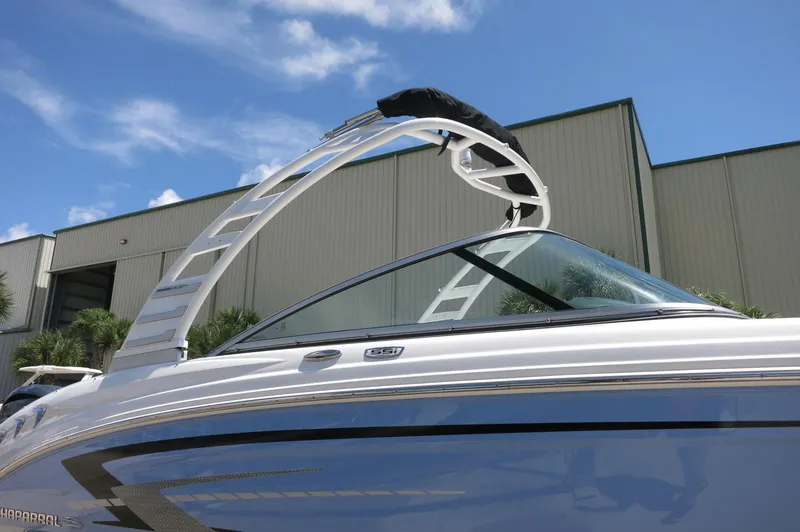 Slide: The Image of 2025 Chaparral 23 SSi OB boat with sleek design and modern features. - 11