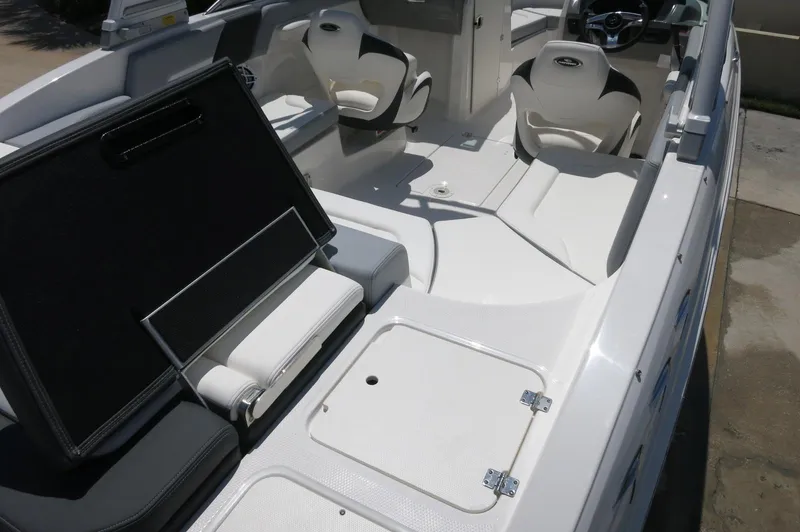 Slide: The Image of 2025 Chaparral 23 SSi OB boat interior with seating and storage compartments. - 15