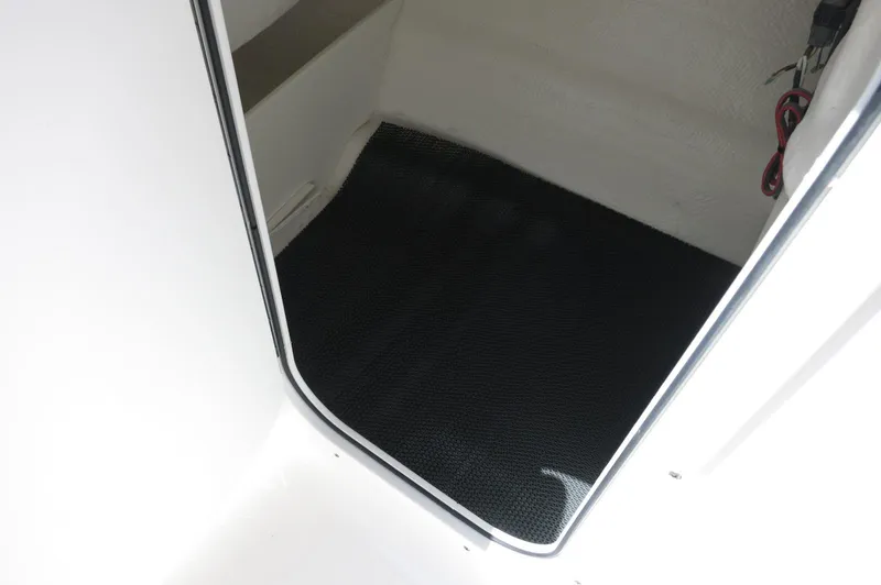 Slide: The Image of Interior view of 2025 Chaparral 23 SSi OB boat storage compartment. - 28