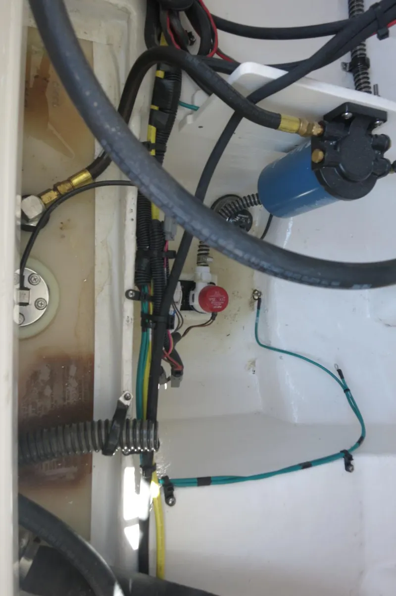 Slide: The Image of Engine compartment of 2025 Chaparral 23 SSi OB with visible wiring and components. - 34