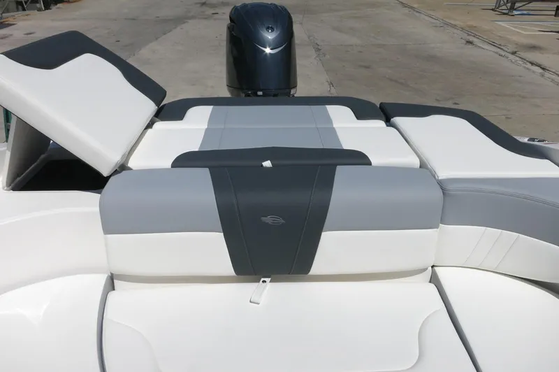 Slide: The Image of 2025 Chaparral 23 SSi OB boat with sleek gray and white seating design. - 35