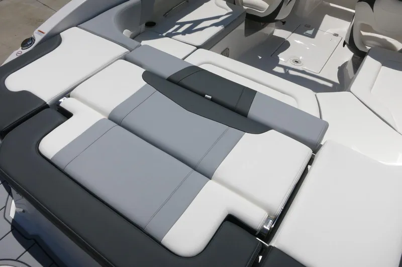 Slide: The Image of 2025 Chaparral 23 SSi OB boat interior with sleek, modern seating design. - 39