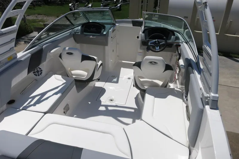 Slide: The Image of 2025 Chaparral 23 SSi OB boat interior with sleek seating and modern dashboard design. - 41