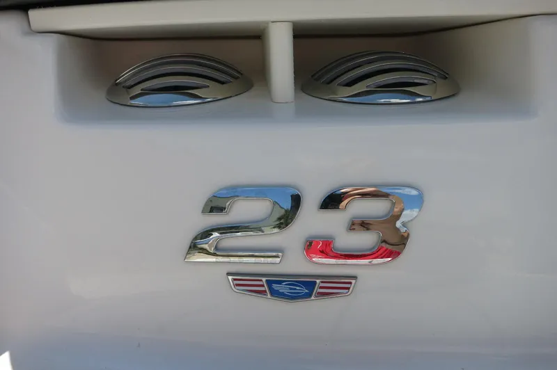 Slide: The Image of 2025 Chaparral 23 SSi OB boat emblem with chrome detailing. - 5