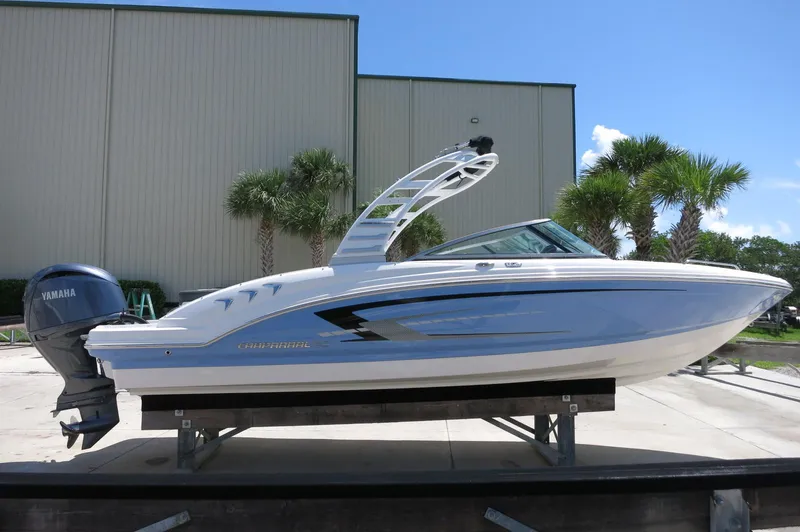 Slide: The Image of 2025 Chaparral 23 SSi OB boat with Yamaha outboard, displayed outdoors. - 9