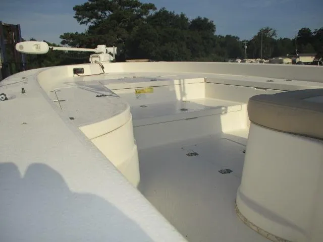 Slide: The Image of 2014 NauticStar 244 XTS boat interior with seating and storage compartments. - 5