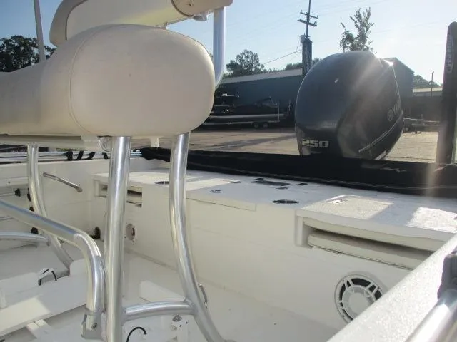 Slide: The Image of 2014 NauticStar 244 XTS boat interior with seating and Yamaha 250 outboard motor. - 6