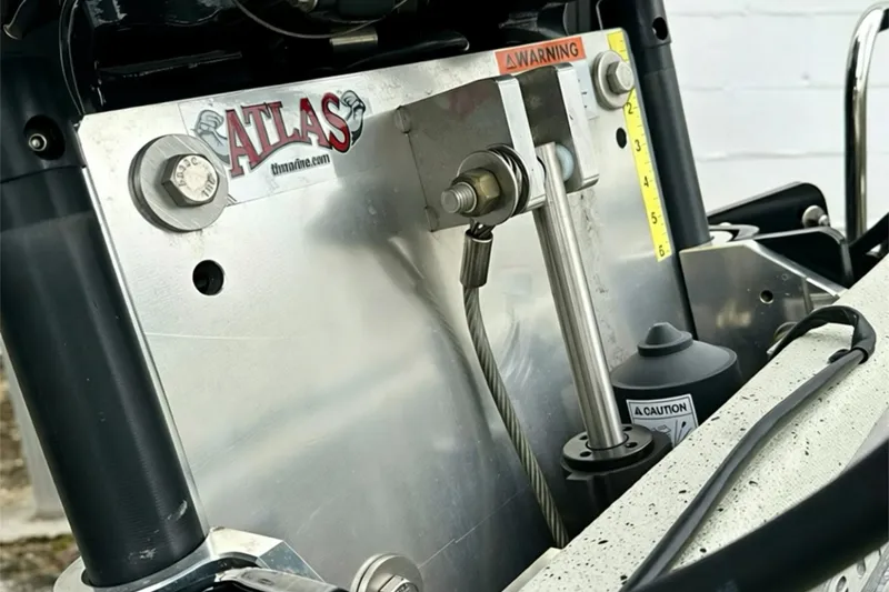 Slide: The Image of Close-up of Ranger RB210 2025 boat engine components with Atlas branding and warning labels. - 15