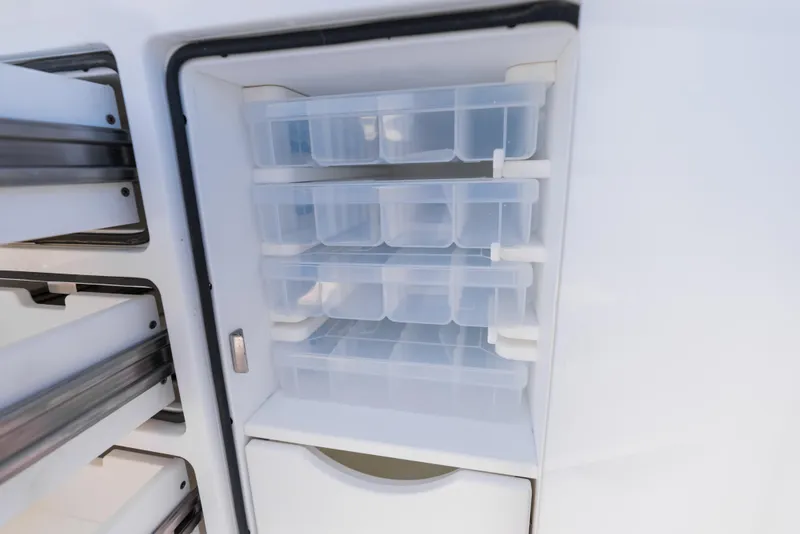 Slide: The Image of Storage compartments on a 2026 Phenom 34 Center Console boat. - 15