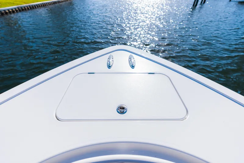 Slide: The Image of Bow of 2026 Phenom 34 Center Console boat on water, sunny day. - 26