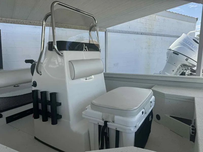 Slide: The Image of 2025 Ranger RB200 boat interior with seating and rod holders. - 2
