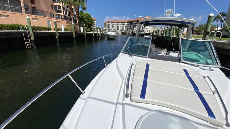 Slide: The Image of 2015 Monterey 295 Sport Yacht docked in a sunny marina setting. - 18