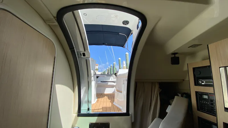 Slide: The Image of Interior view of 2015 Monterey 295 Sport Yacht, showcasing cabin and deck access. - 24