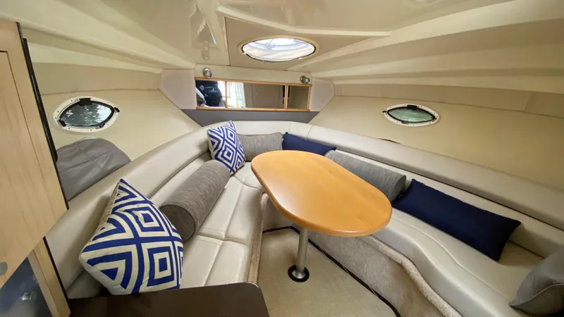 Slide: The Image of Interior of 2015 Monterey 295 Sport Yacht with cozy seating and decorative pillows. - 27