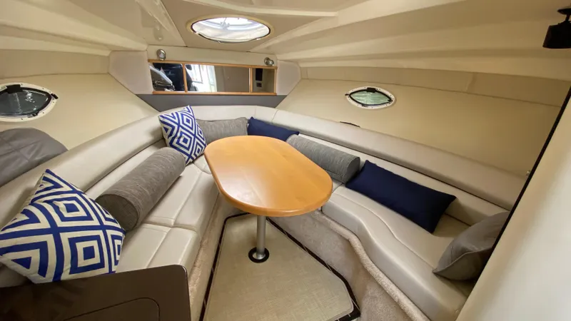Slide: The Image of Interior of 2015 Monterey 295 Sport Yacht with cozy seating and decorative pillows. - 28