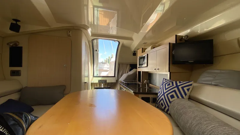 Slide: The Image of Interior of 2015 Monterey 295 Sport Yacht with modern amenities and comfortable seating. - 34