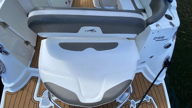 Slide: The Image of 2015 Monterey 295 Sport Yacht seating area with teak flooring and sleek design. - 4