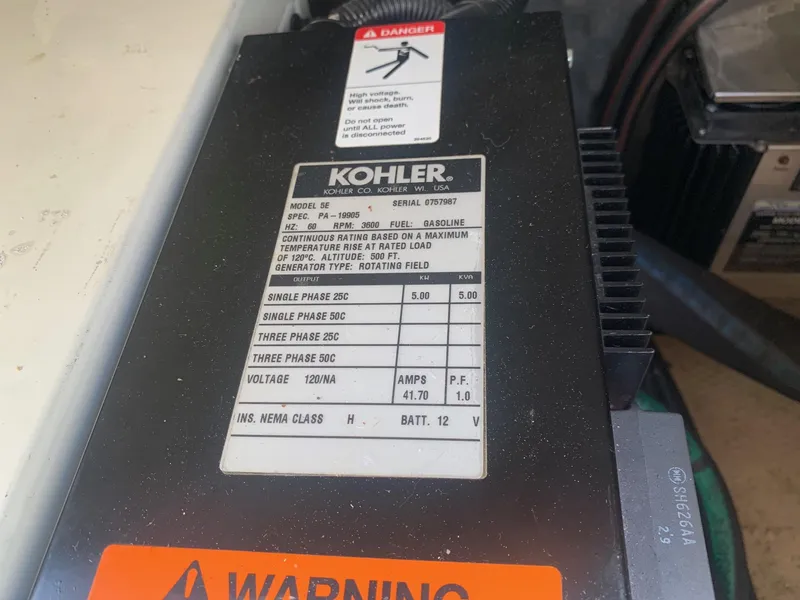 Slide: The Image of Kohler generator label on a 2003 Rinker FIESTA VEE 270 boat. - 19