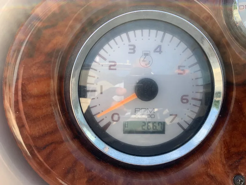 Slide: The Image of Close-up of a 2003 Rinker FIESTA VEE 270 tachometer displaying 266.4 hours. - 25