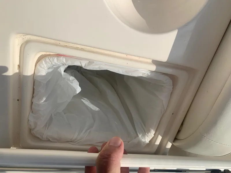 Slide: The Image of Trash bin with liner on a 2003 Rinker Fiesta Vee 270 boat. - 27
