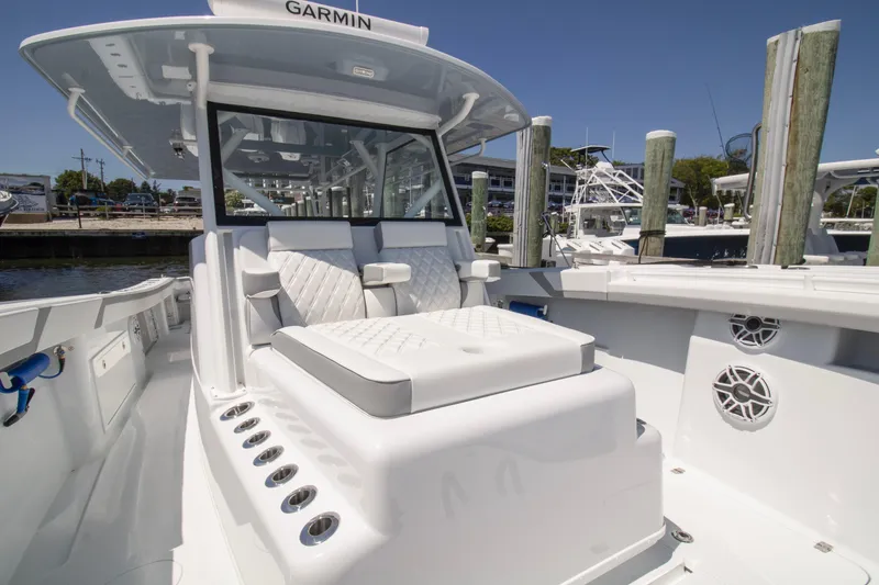 Slide: The Image of 2026 Yellowfin 42 Offshore boat with luxurious seating and advanced Garmin navigation system. - 11