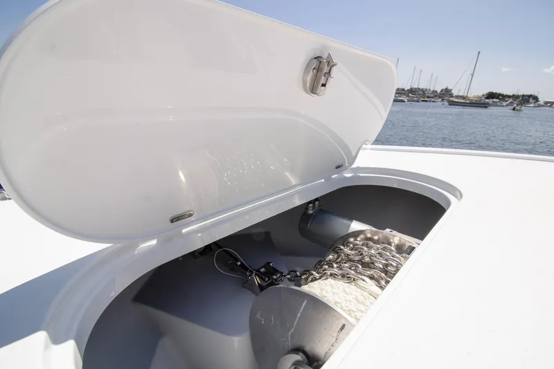 Slide: The Image of Open anchor locker on 2026 Yellowfin 42 Offshore boat, showing chain and rope. - 14