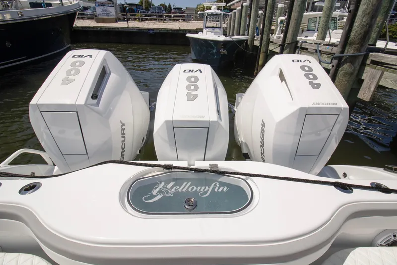 Slide: The Image of 2026 Yellowfin 42 Offshore boat with triple Mercury 400 engines docked at marina. - 17