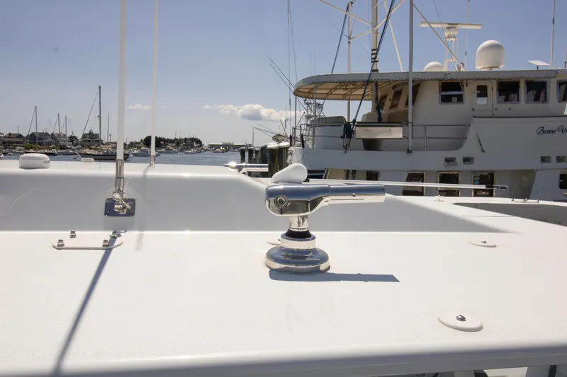 Slide: The Image of 2026 Yellowfin 42 Offshore boat detail with marina background. - 22