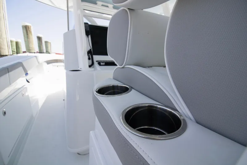 Slide: The Image of 2026 Yellowfin 42 Offshore boat interior with cup holders and seating. - 37