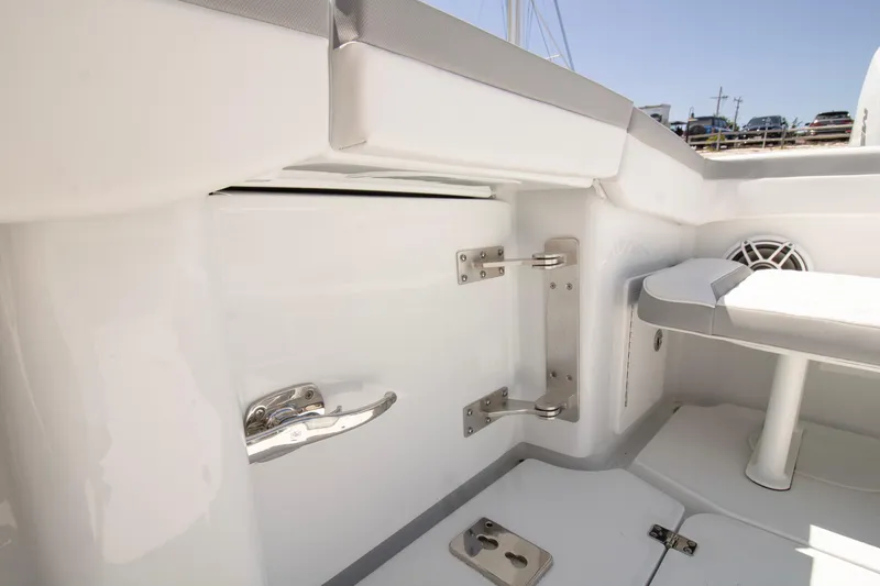 Slide: The Image of 2026 Yellowfin 42 Offshore boat interior with sleek white seating and stainless steel hardware. - 40