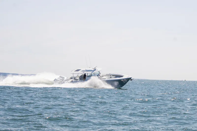 Slide: The Image of 2026 Yellowfin 42 Offshore boat speeding on open water. - 5