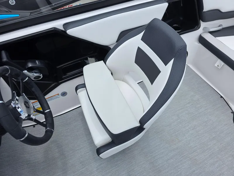 Slide: The Image of 2025 Yamaha Boats AR195 interior with sleek captain's chair and steering wheel. - 11