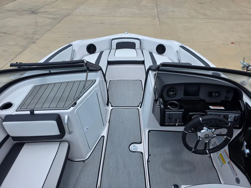 Slide: The Image of 2025 Yamaha Boats AR195 interior with sleek design and modern dashboard features. - 5