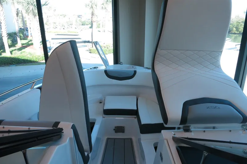 Slide: The Image of 2025 Chaparral 250 OSX boat interior with modern seating and sleek design. - 13