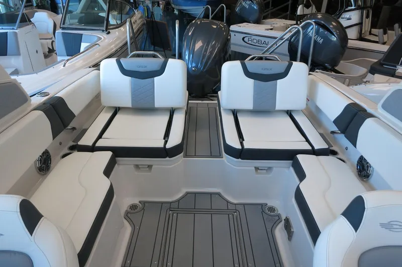 Slide: The Image of 2025 Chaparral 250 OSX boat interior with luxurious seating and modern design. - 25