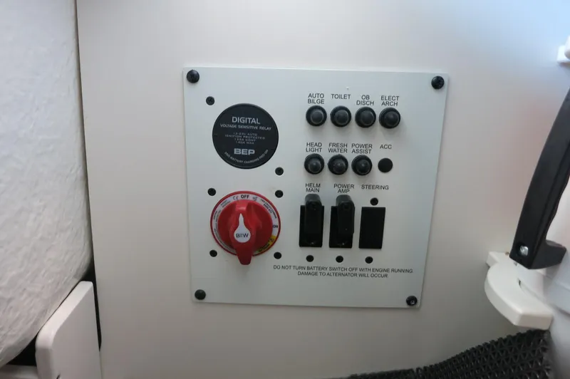 Slide: The Image of Control panel of 2025 Chaparral 250 OSX boat with switches and battery relay. - 27