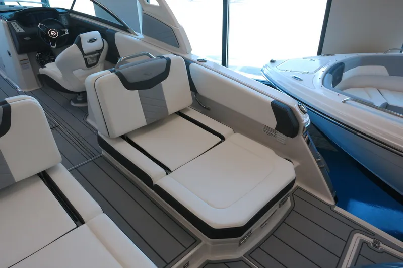 Slide: The Image of 2025 Chaparral 250 OSX boat interior with modern seating and sleek design. - 31