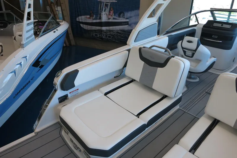 Slide: The Image of 2025 Chaparral 250 OSX boat interior with white seating and modern design. - 32