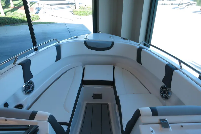 Slide: The Image of 2025 Chaparral 250 OSX boat interior with sleek seating and modern design. - 7