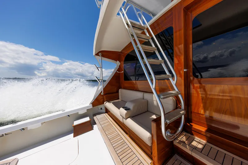 Slide: The Image of Luxurious 2002 Post Convertible 56 yacht interior with wooden finish and ocean view. - 28