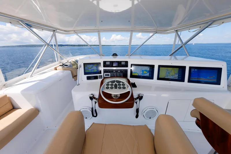 Slide: The Image of Helm of 2002 Post Convertible 56 yacht with navigation screens and ocean view. - 35