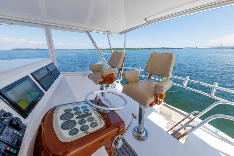Slide: The Image of Luxury yacht helm with leather seats and navigation screens, Post Convertible 56, 2002 model. - 37