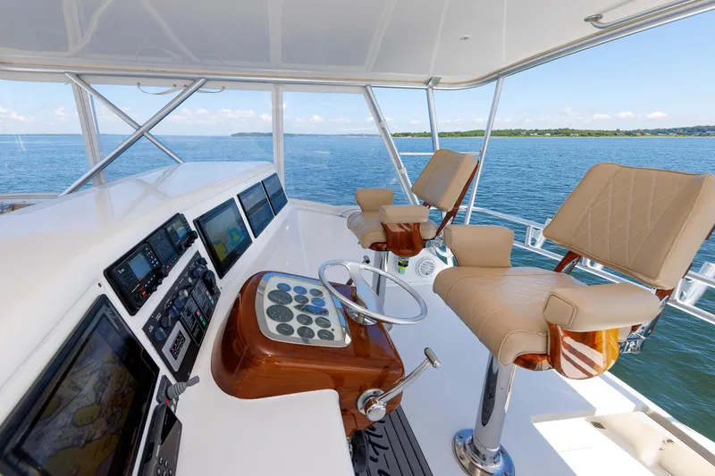 Slide: The Image of Luxurious yacht helm with leather seats, advanced navigation systems, and ocean view. - 38
