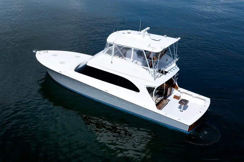 Slide: The Image of 2002 Post Convertible 56 yacht cruising on calm waters, aerial view. - 4