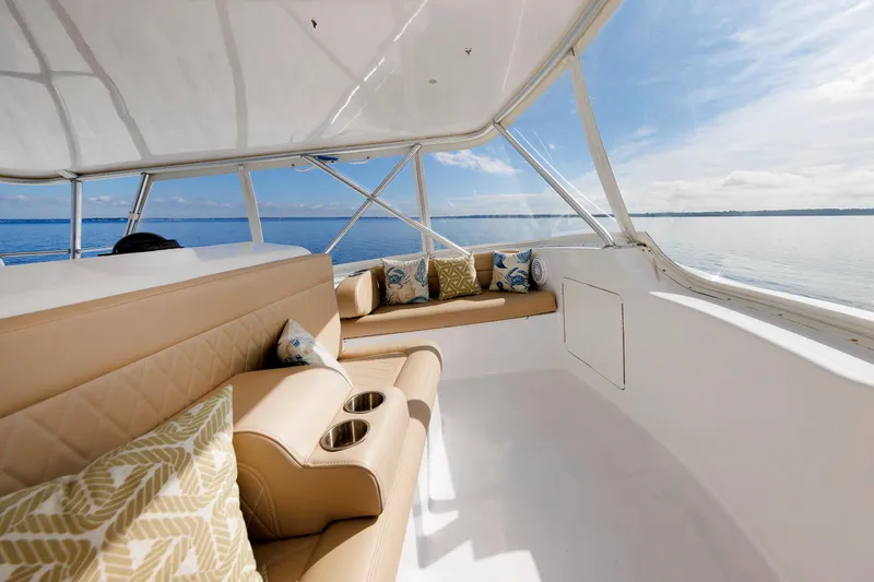 Slide: The Image of Luxurious interior of a 2002 Post Convertible 56 yacht with beige seating and ocean view. - 41