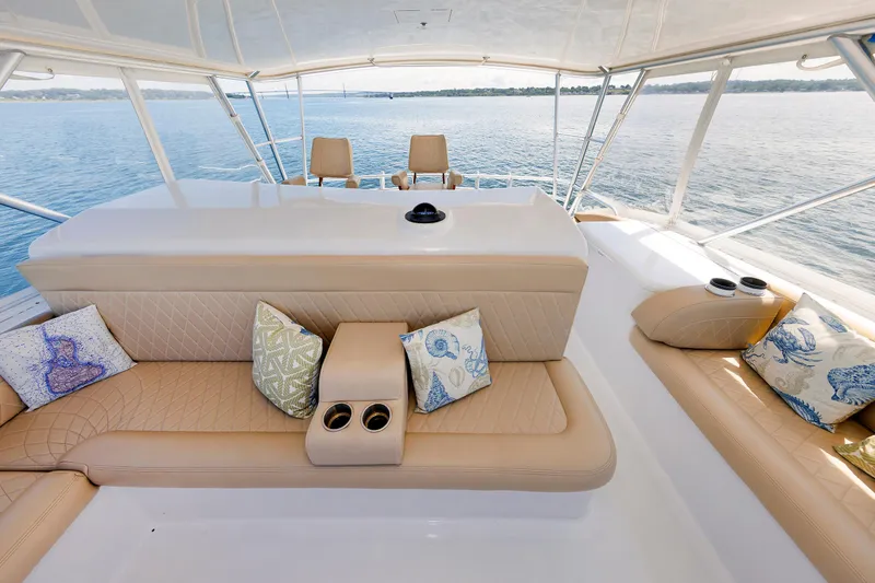 Slide: The Image of Luxurious 2002 Post Convertible 56 yacht interior with beige seating and decorative pillows. - 45
