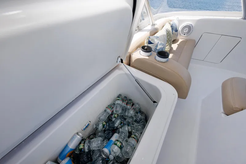 Slide: The Image of Interior of a 2002 Post Convertible 56 yacht with cooler and seating area. - 46