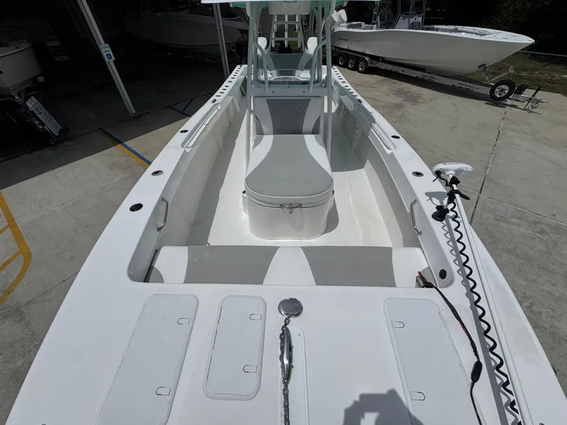 Slide: The Image of 2020 Twin Vee 310 CC GF boat interior with seating and storage compartments. - 25