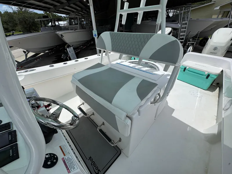 Slide: The Image of 2020 Twin Vee 310 CC GF boat interior with helm and seating area. - 30